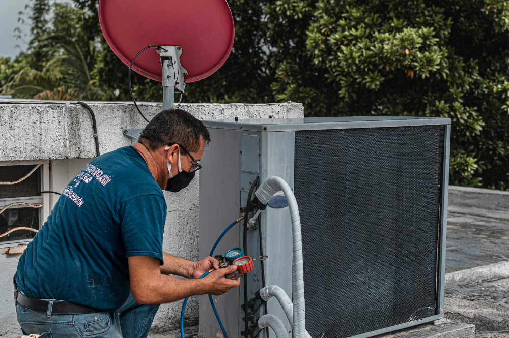n engineer checking pressure gauges during commercial hvac installation services handled by Pujnik.